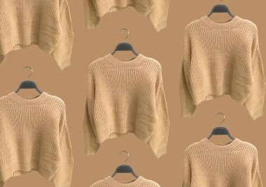 Kahverengi arka planda izole edilmiş askı üzerindeki bej rengi örgü süveterler. Kıyafet kompozisyonu. Banner konsepti. Moda kıyafet kolajı. Moda konsepti. Desen