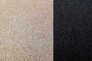 Metin için alanı olan çift renkli siyah ve altın parıltılı arkaplan.