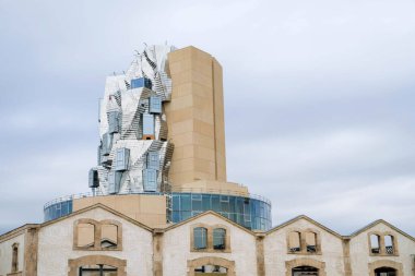 Luma Arles cultural centre with twisting tower in reflective aluminium panels.