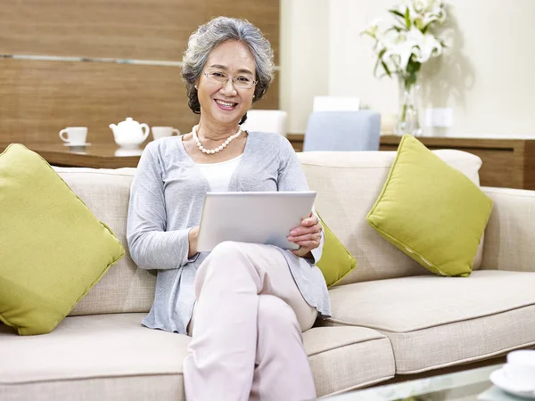 Senior asian woman relaxing at home — Stock Photo, Image