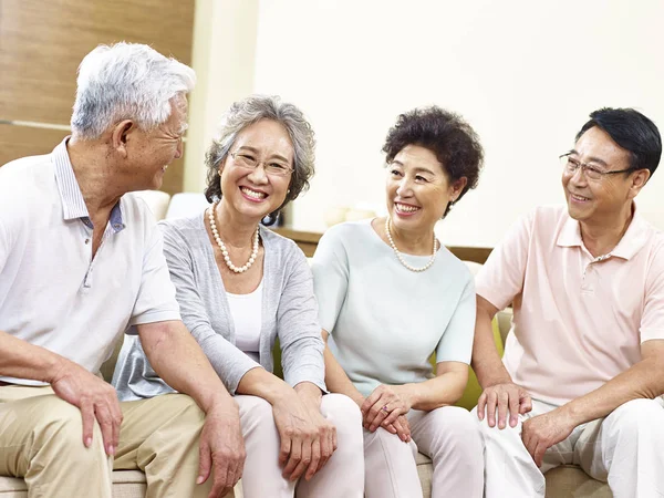 Happy senior asian couples chatting at home — Stock Photo, Image