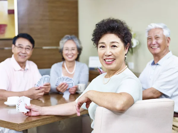 Senior asian woman in  card game — Stock Photo, Image