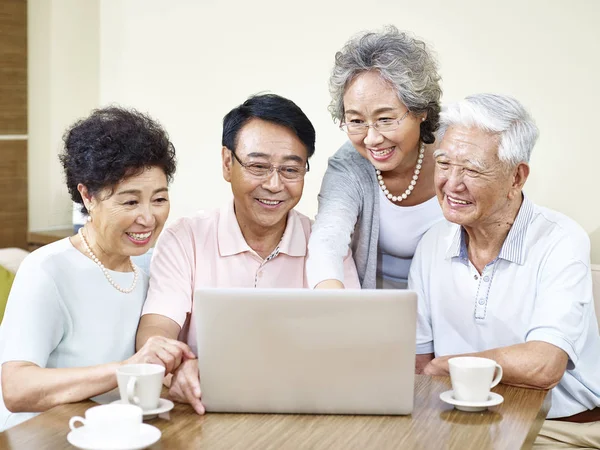 Senior asian friends gathering at home — Stock Photo, Image
