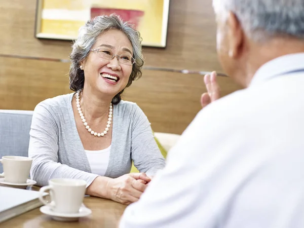 Loving senior asian couple chatting — Stock Photo, Image