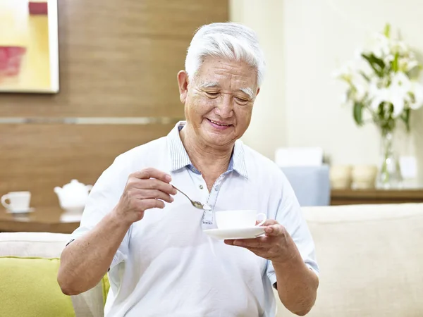 Senior asian man drinking coffee — Stock Photo, Image