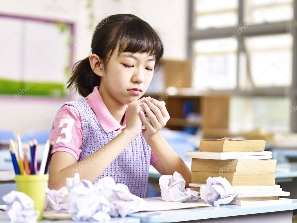 frustrated asian elementary school girl