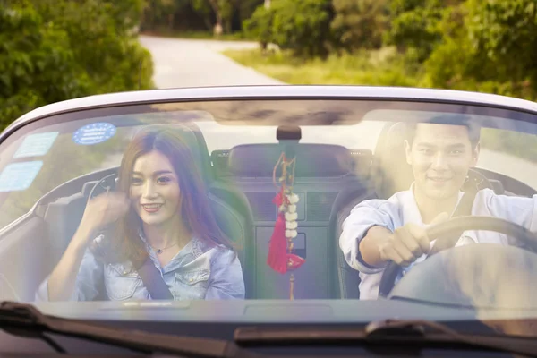 Young asian couple enjoying a ride — Stock Photo, Image