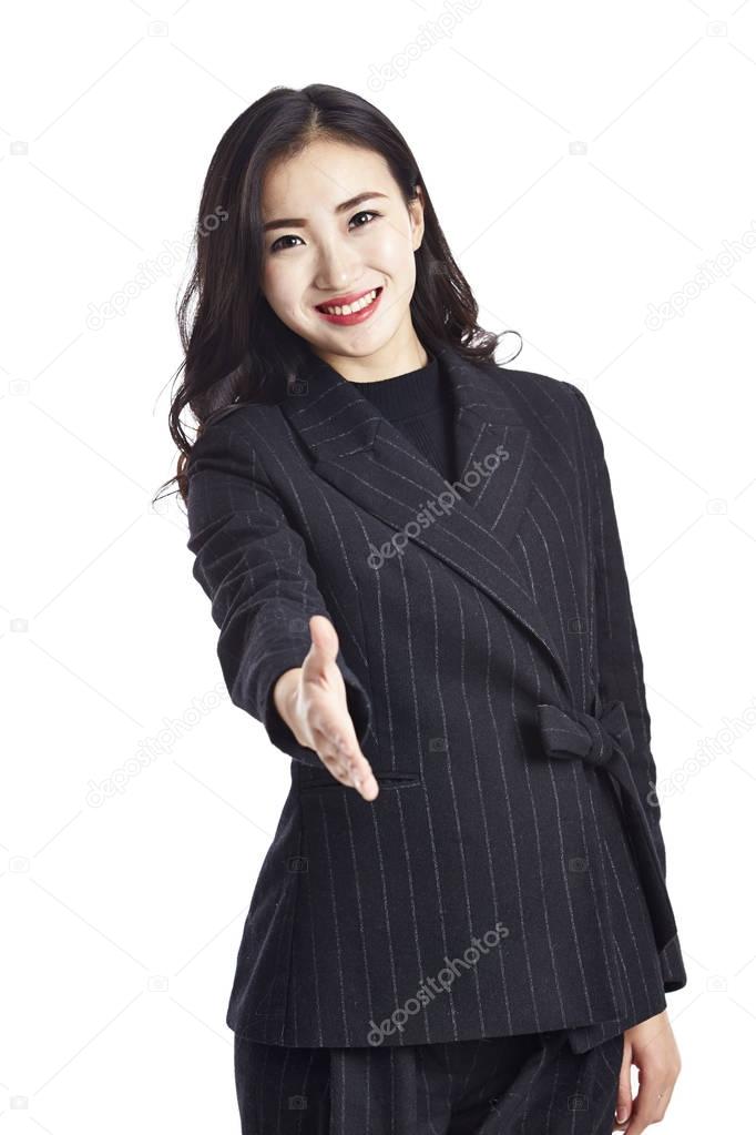 asian businesswoman reaching out for handshake