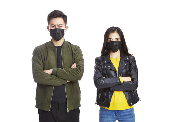 young asian couple wearing black mask