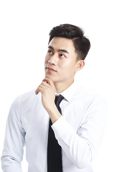 Asian corporate executive looking up thinking — Stock Photo, Image