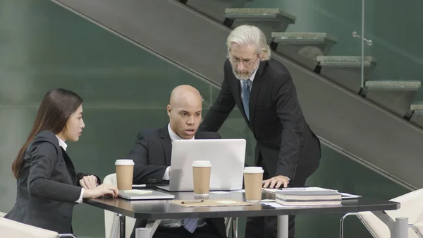 Three coporate executives meeting in office — Stock Photo, Image