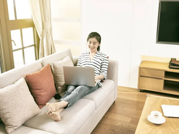 Young asian woman working at home — Stock Photo, Image