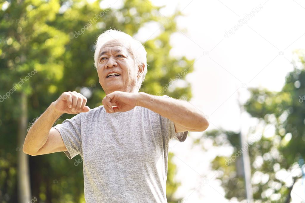 asian old man exercising outdoors