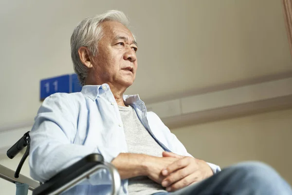 Asian old man sitting in wheel chair in nursing home — Stock Photo, Image