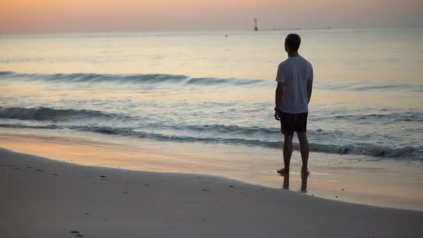 Vibrant Sunset Beautiful Tropical Beach Man Looking Sun Calm Waves — Stock Video