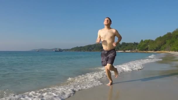 Young Man Jogging Tropical Beach Slow Motion — Stock Video