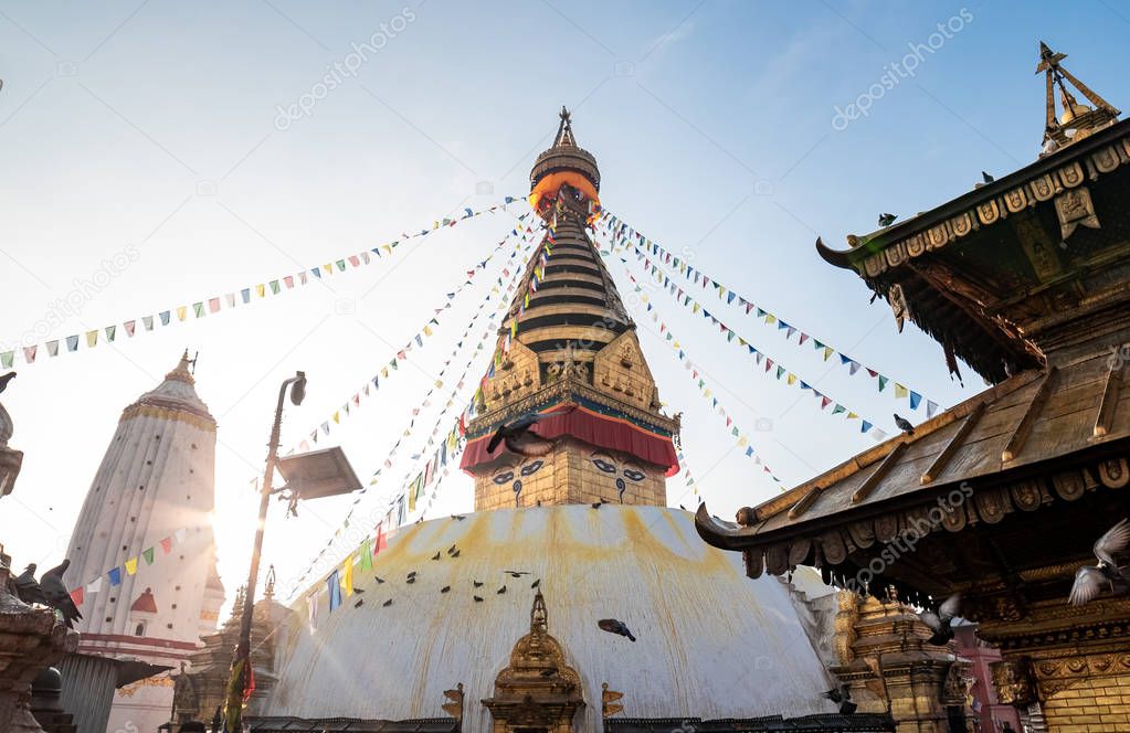 Swayambhunath Stupa, aka The Monkey Temple, during sunrise in Kathmandu, Nepal. A UNESCO Heritage Site. Ancient ruins and stone temples.