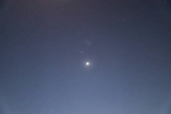 Long exposure of Venus planet with stars at night. selective focus