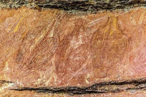 Ancient Aboriginal Art: hand prints, animal herds, spiral, Kakadu National Park, Australia