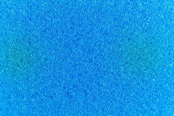 Esponja azul hecha de material de microfibra. Textura, fondo. En aumento —  Fotos de Stock