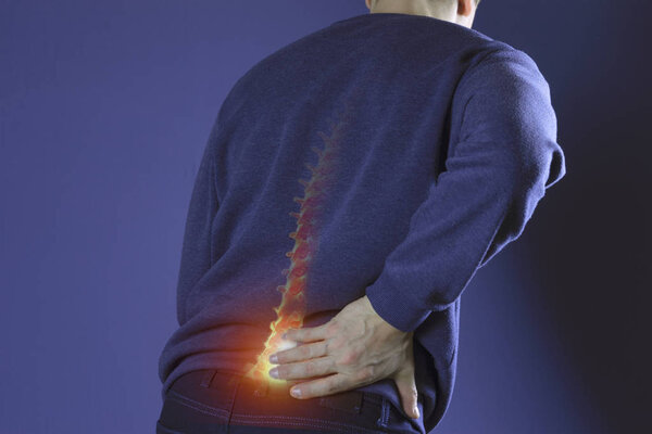 Man suffering from back pain. Health and medical insurance concept.