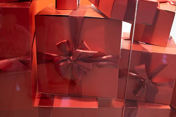 lifestyle and birthday present concept - Luxury holiday gifts on red