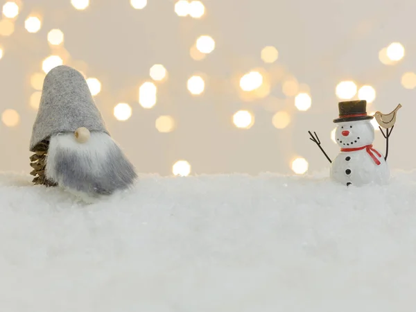 Christmas Decorative Gnome Snowman Toys White Snow Shining Lights Background — Stock Photo, Image