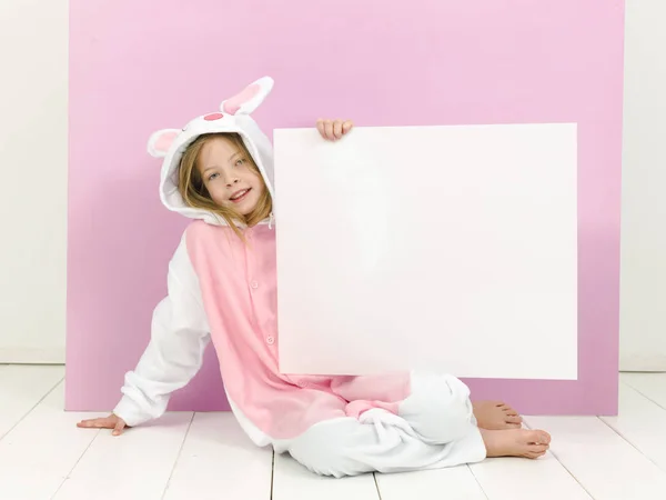 Happy Pretty Blonde Girl Cozy Rabbit Costume White Sign Posing — 스톡 사진