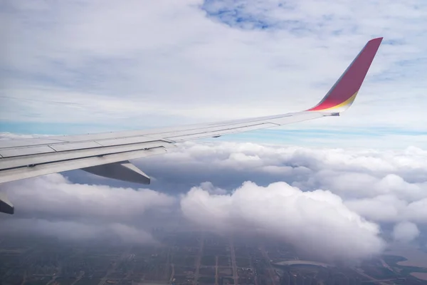 Clouds and sky as seen through window of an aircraft — Stock Photo, Image