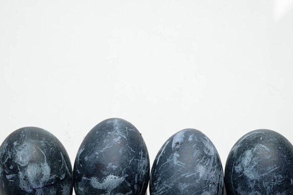 gray easter eggs on a pink background