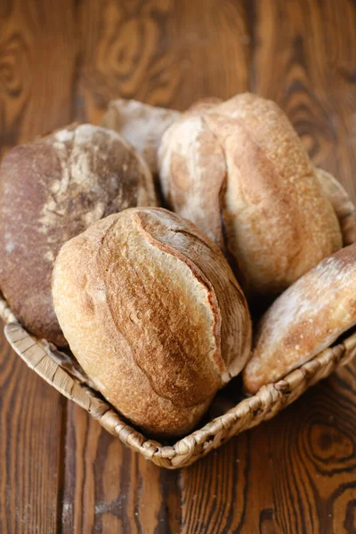 Loaves Fresh Bread Wicker Plate Wooden Tabletop — Stock Photo, Image