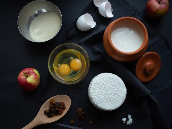 Variety of ingredients for cheesecake on table