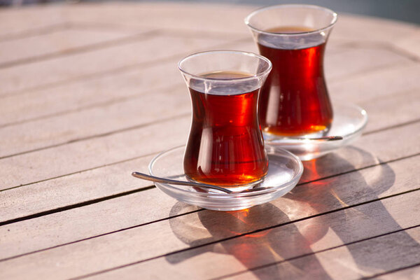 Tea served in turkish glass cups with plates
