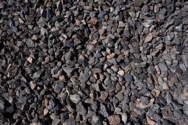 Yerdeki küçük çakıl taşlarının desenli arka planı