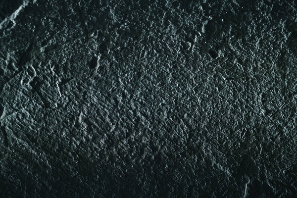 Dark stucco textured background, house wall.