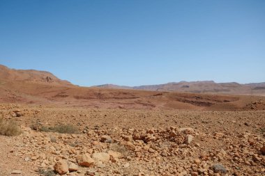 Drought land desert arid landscape against clear blue sky