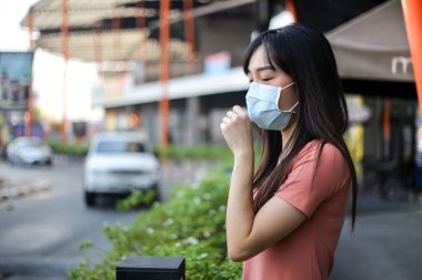 Beautiful asia  Woman suffer from sick and wearing face mask  pr