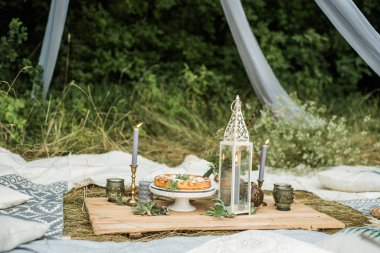 Mint decorated apple pie. Picnic in the style of boho.