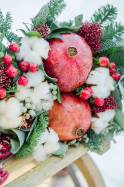 Winter bridal bouquet with garnet and green tree