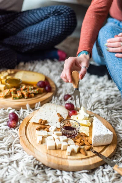 Cheese plate served with nuts, Top view. Assorted cheeses Camembert, Brie, Parmesan blue cheese, goat. — Stock Photo, Image