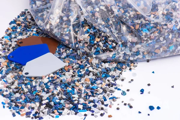 Plastic regrind with samples — Stock Photo, Image