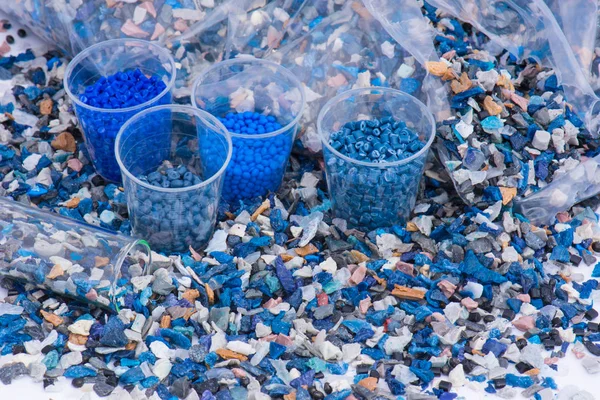 Plastic regrind with test glasses and bag — Stock Photo, Image