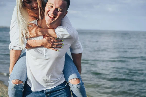 Attractive Blonde Girl Jumped Her Boyfriend Back Carries Her She — Stock Photo, Image