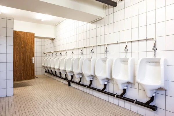 Urinal and toilet doors — Stock Photo, Image