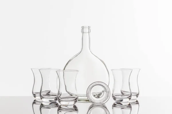 Empty transparent bottle and glass — Stock Photo, Image