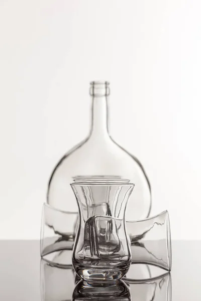 Empty transparent bottle and glass — Stock Photo, Image