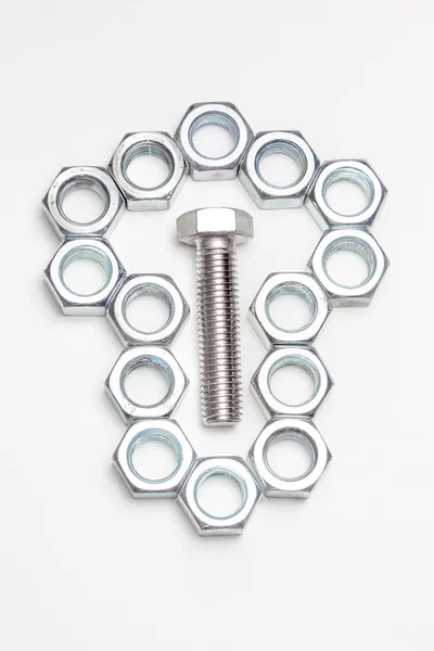 One lying bolt and various nut — Stock Photo, Image