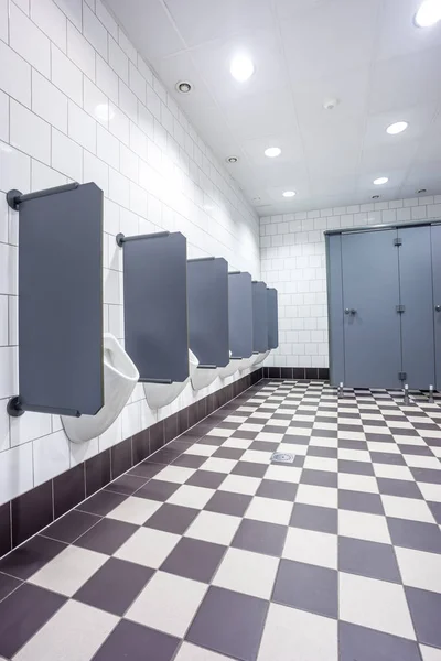 Urinal and toilet doors — Stock Photo, Image