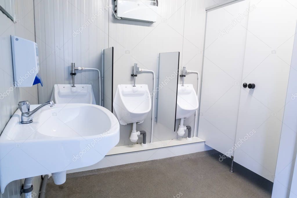 urinal and sink in a container