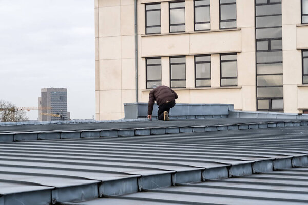 The zinc roof of a large building in the middle of the city